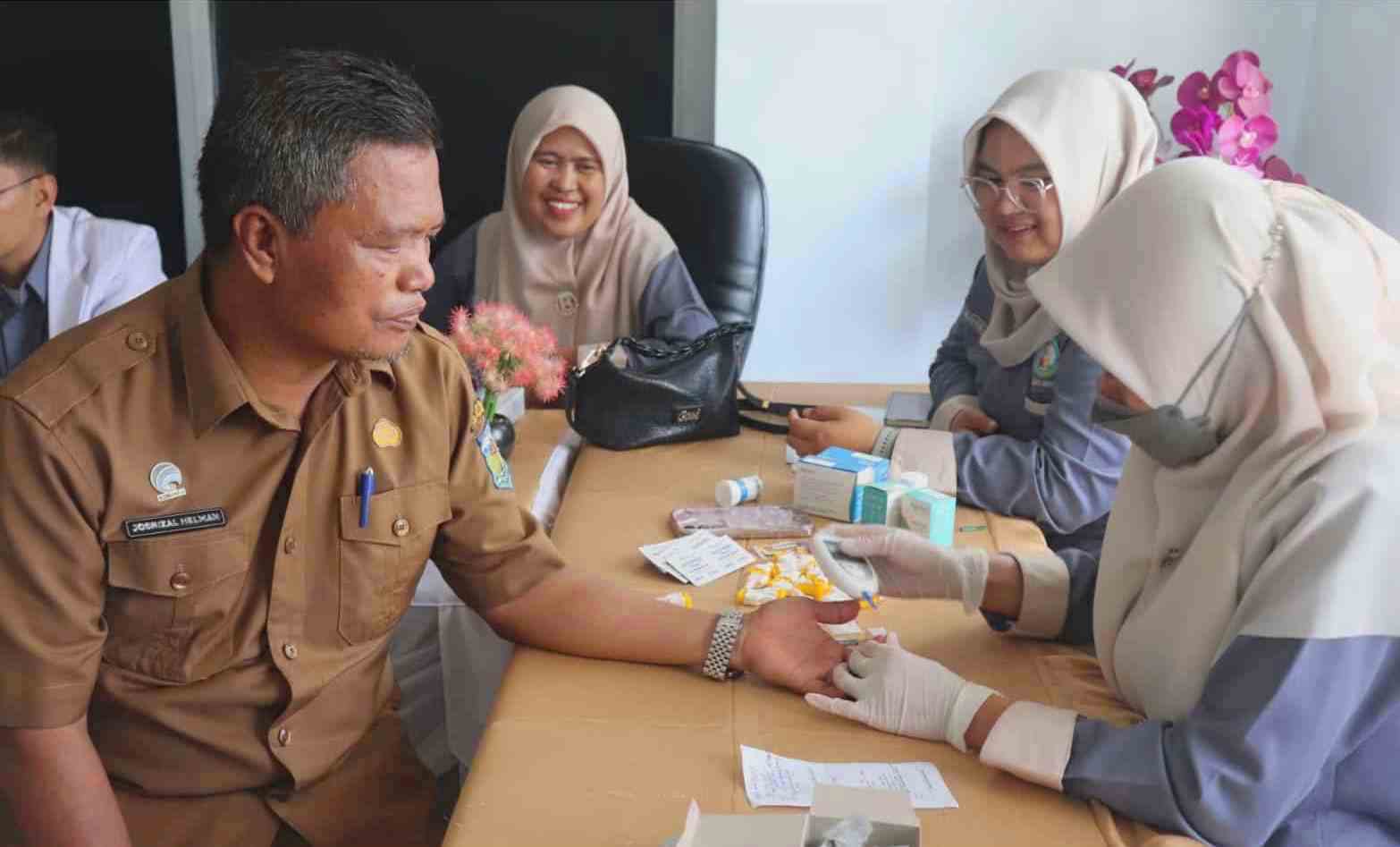 Kepala Dinas Diskominfosta Kota Sungai Penuh, H. Josrizal Helman, S.Si., Apt,